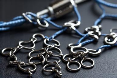 High-strength braided fishing line and stainless steel swivels, clips, and crimps, organized neatly, suitable for extreme depth fishing.